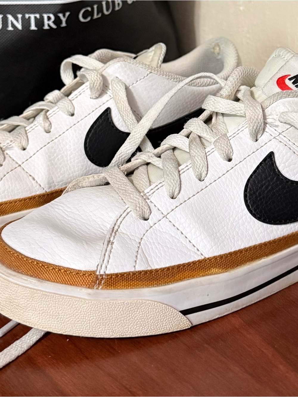 Nike Women’s White Sneakers with Black Swoosh and Brown Trim